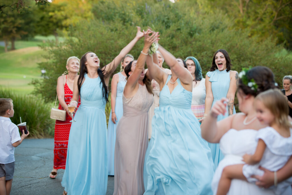 Bridal Party trying to catch boquet