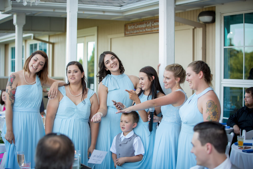 Bridesmaids giving speech at reception